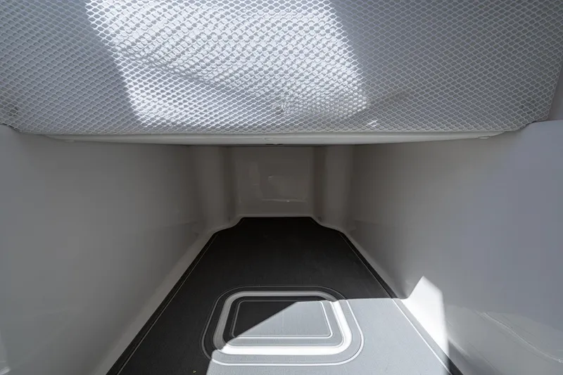 Slide: The Image of 2025 Invincible 33 Open Fisherman interior storage compartment, featuring a spacious and clean design. - 34