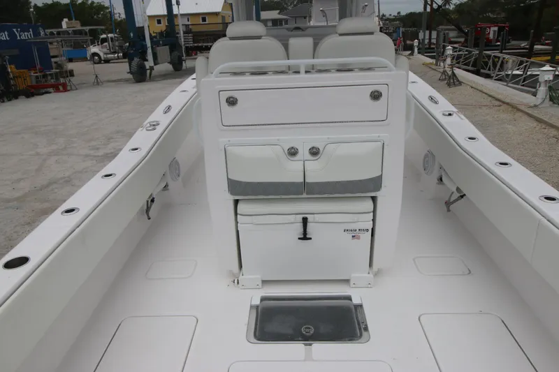 Slide: The Image of 2025 Invincible 33 Open Fisherman boat interior, featuring seating and storage compartments. - 4