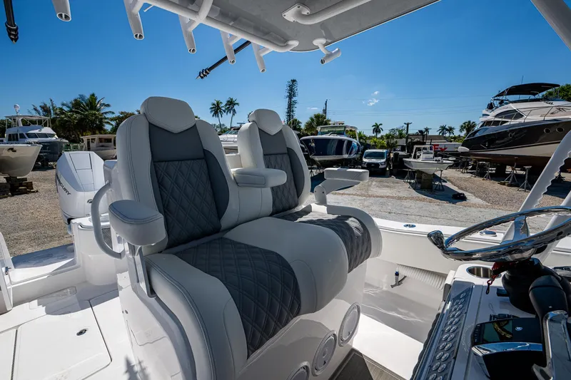 Slide: The Image of 2025 Invincible 33 Open Fisherman boat interior with luxurious seating and steering console. - 41