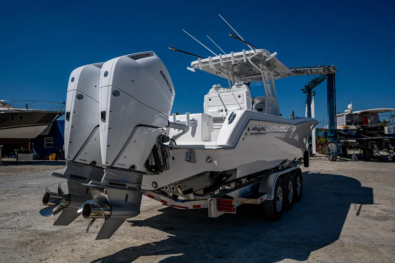 Slide: The Image of 2025 Invincible 33 Open Fisherman boat with dual engines on a trailer. - 47