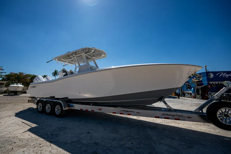 Slide: The Image of 2025 Invincible 33 Open Fisherman boat on trailer under clear blue sky. - 49