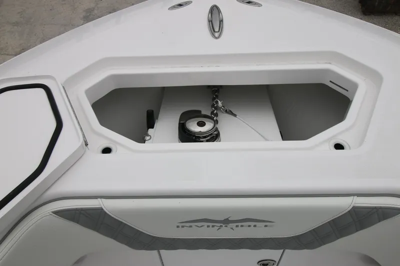 Slide: The Image of 2025 Invincible 33 Open Fisherman boat anchor compartment, showcasing sleek design and functionality. - 8