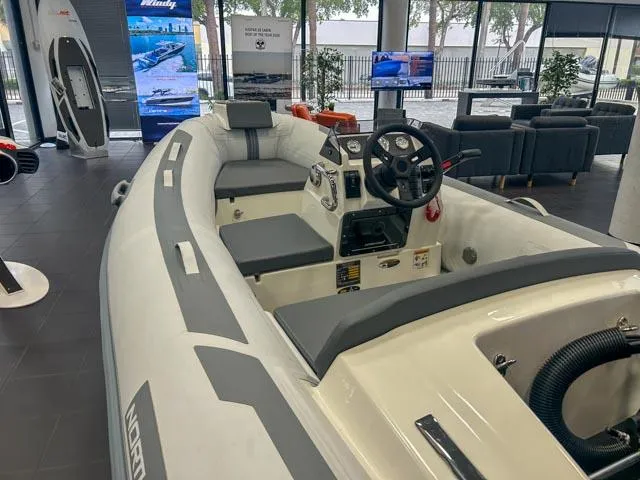 Slide: The Image of 2021 Northstar Axis 3.1 inflatable boat displayed in a showroom setting. - 6