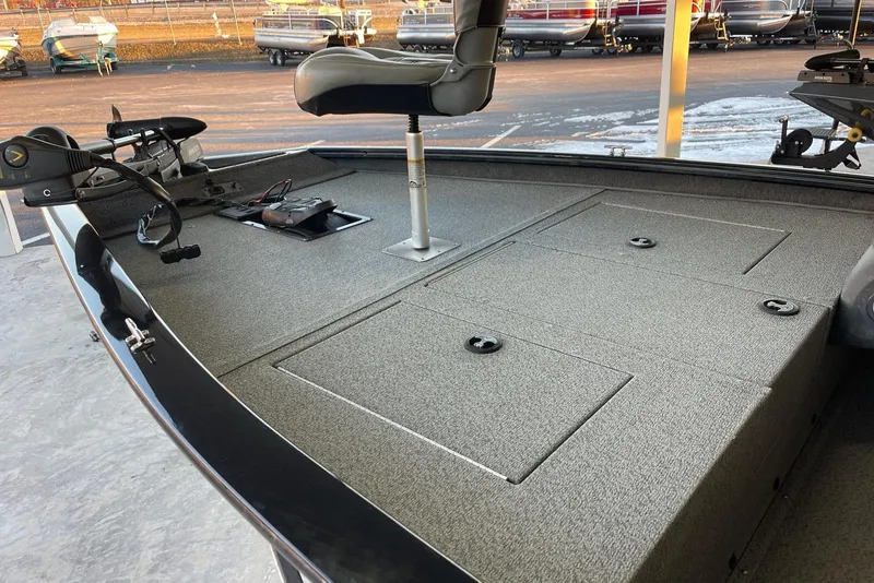 Slide: The Image of 2018 Tracker Pro Team 175TXW fishing boat deck with seat and storage compartments. - 4