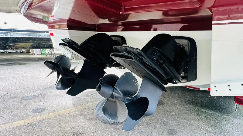 Slide: The Image of 2013 Beneteau GRAN TURISMO boat propellers, close-up view, parked on concrete surface. - 5