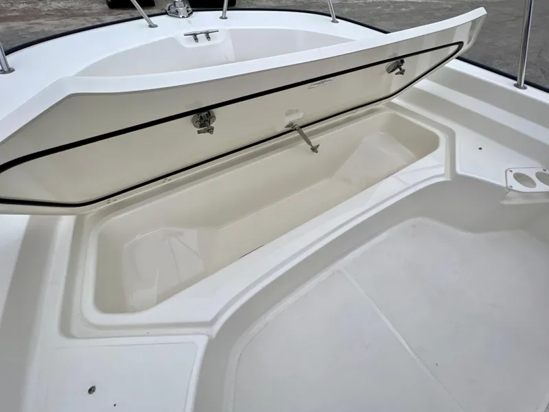 Slide: The Image of Open storage compartment on 2025 Boston Whaler 190 Montauk boat. - 13