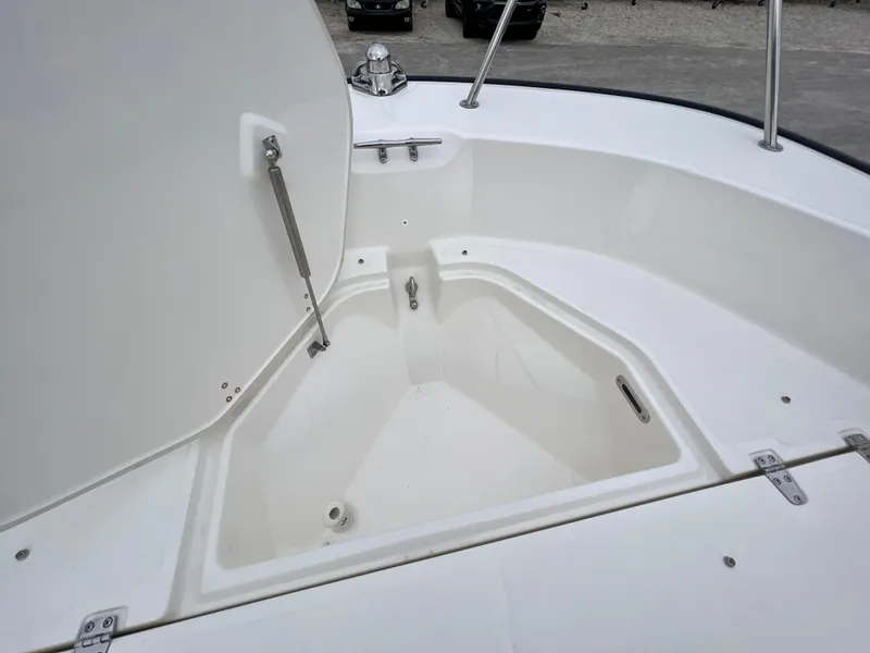 Slide: The Image of 2025 Boston Whaler 190 Montauk boat storage compartment open. - 14
