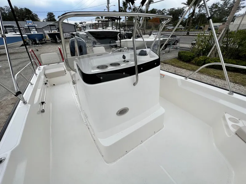 Slide: The Image of 2025 Boston Whaler 190 Montauk boat interior with center console and seating. - 15