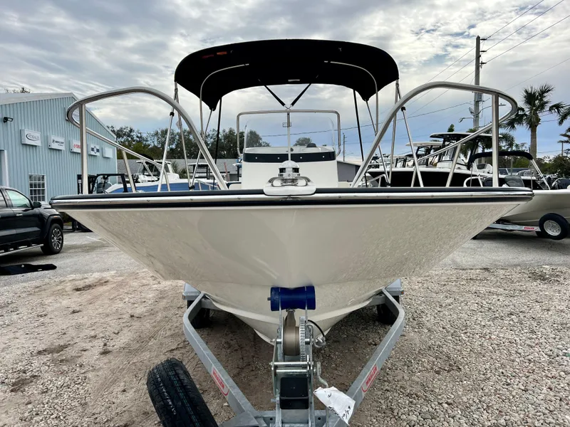 Slide: The Image of 2025 Boston Whaler 190 Montauk boat on trailer, front view, outdoor display. - 3