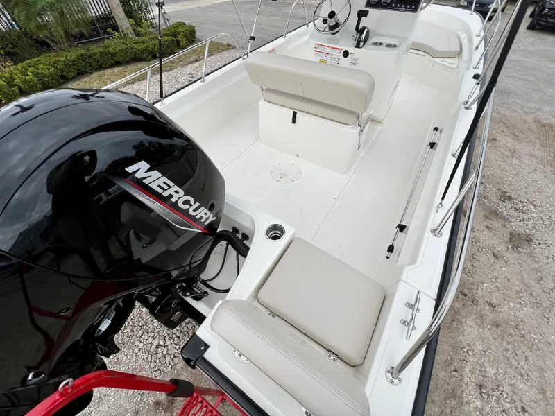 Slide: The Image of 2025 Boston Whaler 190 Montauk boat with Mercury engine, interior view. - 9