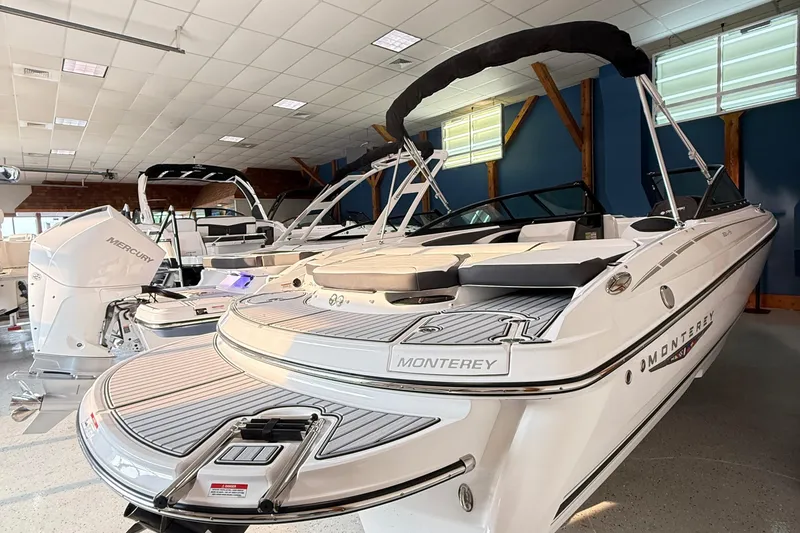 Slide: The Image of 2025 Monterey 224FS boat displayed in showroom, featuring sleek design and modern amenities. - 1