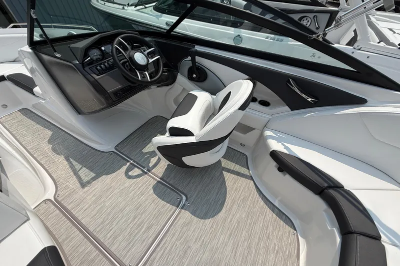 Slide: The Image of Interior of 2025 Monterey 224FS boat with sleek design and modern dashboard. - 11