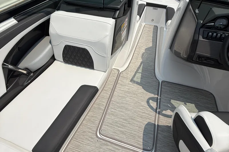 Slide: The Image of 2025 Monterey 224FS boat interior with sleek seating and modern dashboard design. - 5