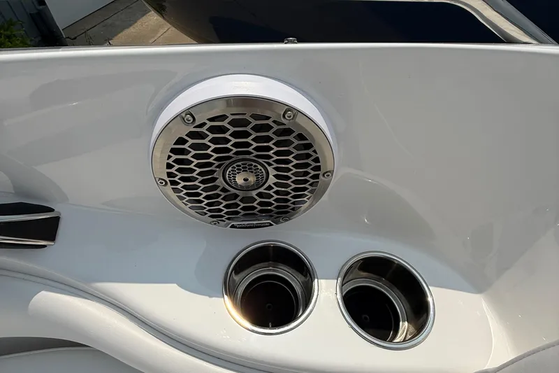 Slide: The Image of 2025 Monterey 224FS boat interior with speaker and cup holders. - 8