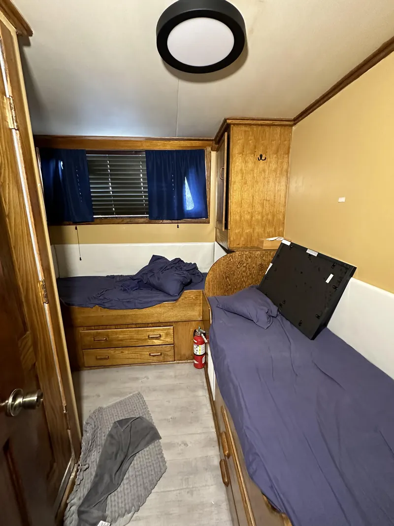 Slide: The Image of Interior of a 1965 custom dive boat cabin with twin beds and wooden furnishings. - 15