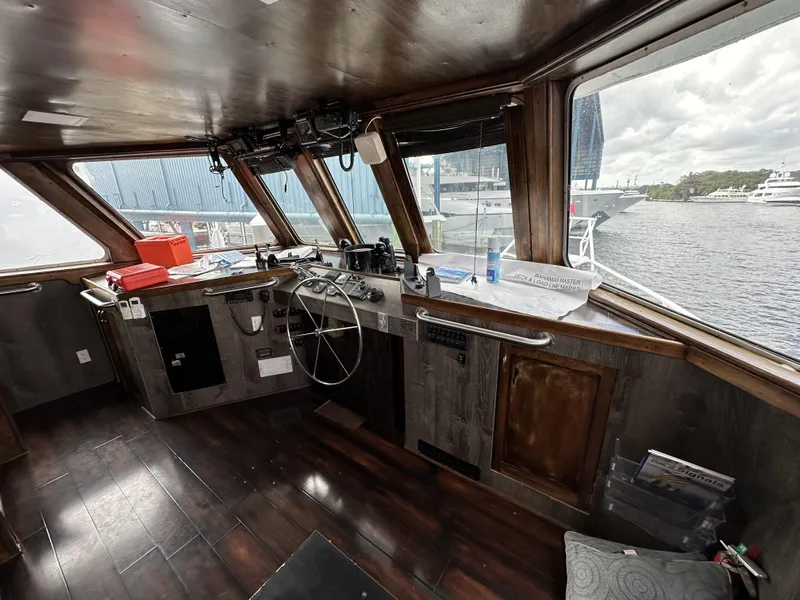 Slide: The Image of Interior of a 1965 custom dive boat with wooden helm and large windows. - 30