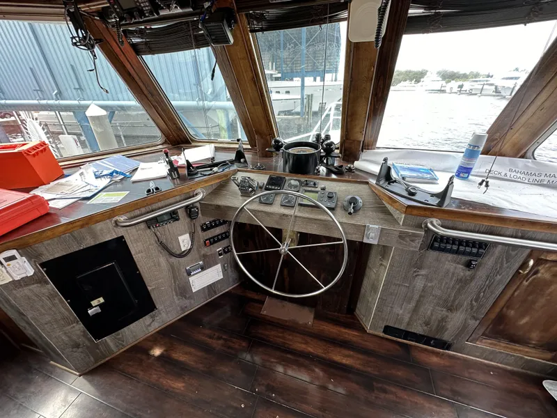 Slide: The Image of Interior of a 1965 custom dive boat cockpit with steering wheel and control panels. - 32