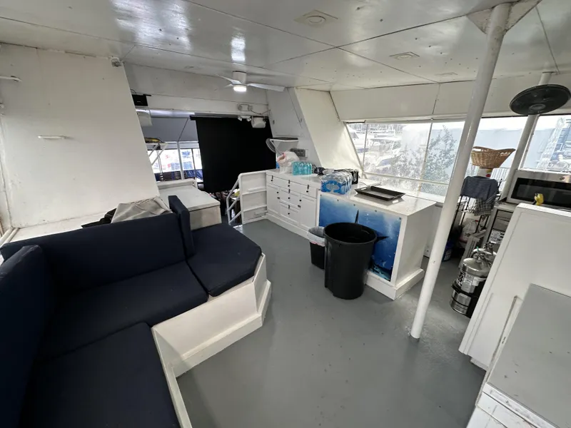 Slide: The Image of Interior of a 1965 custom dive boat with seating, storage, and equipment. - 39