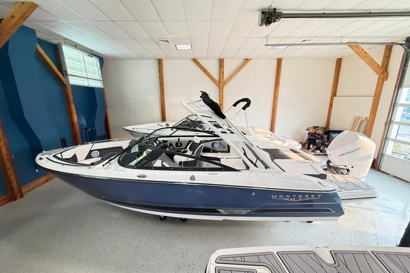 The Image of 2025 Monterey 235SS Super Sport boat in a showroom, featuring sleek design and modern features. - 0