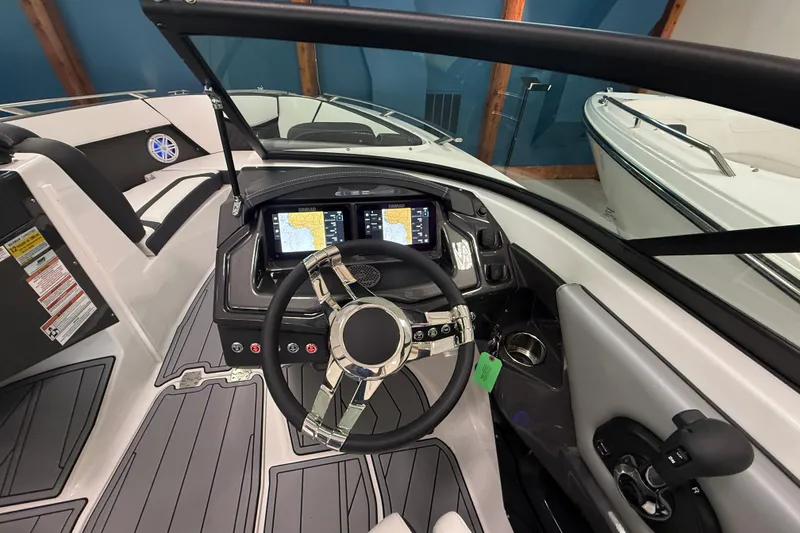 Slide: The Image of 2025 Monterey 235SS Super Sport boat interior with modern dashboard and steering wheel. - 12