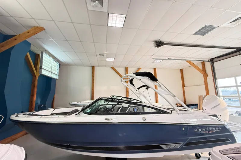 Slide: The Image of 2025 Monterey 235SS Super Sport boat in showroom, featuring sleek design and modern features. - 3