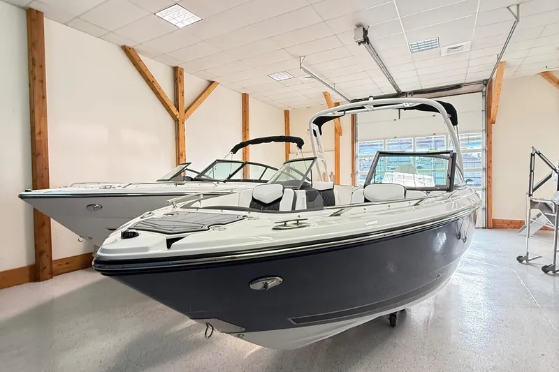 Slide: The Image of 2025 Monterey 235SS Super Sport boat in showroom, sleek design, modern features. - 4