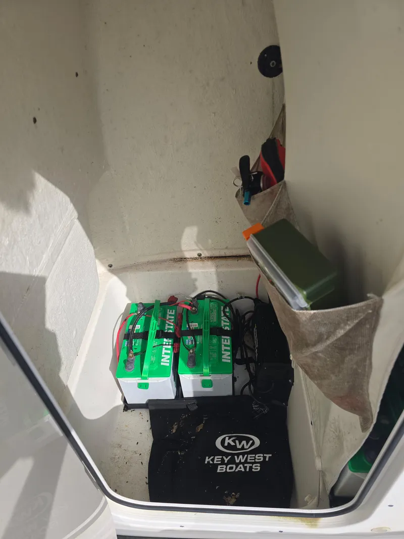 Slide: The Image of Key West 189 FS 2020 boat storage with batteries and equipment. - 14