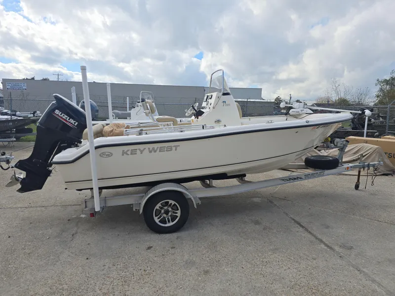 Slide: The Image of 2020 Key West 189 FS boat on trailer with Suzuki outboard motor. - 2