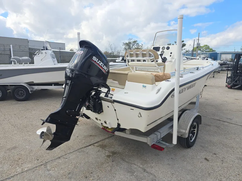 Slide: The Image of 2020 Key West 189 FS boat with Suzuki outboard motor on trailer. - 3