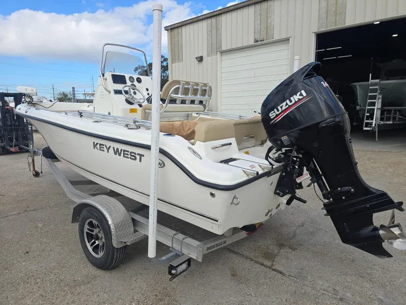 Slide: The Image of 2020 Key West 189 FS boat with Suzuki outboard motor on a trailer. - 4
