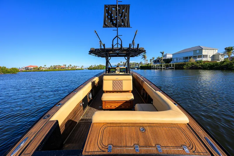 Slide: The Image of 2005 Midnight Express 39S Open boat on calm water, clear blue sky. - 21