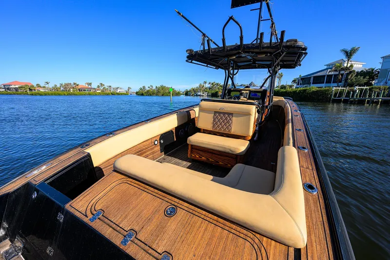 Slide: The Image of 2005 Midnight Express 39S Open boat with tan seating on a sunny day. - 22