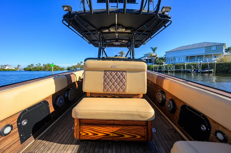 Slide: The Image of 2005 Midnight Express 39S Open boat interior with luxurious seating and waterfront view. - 24