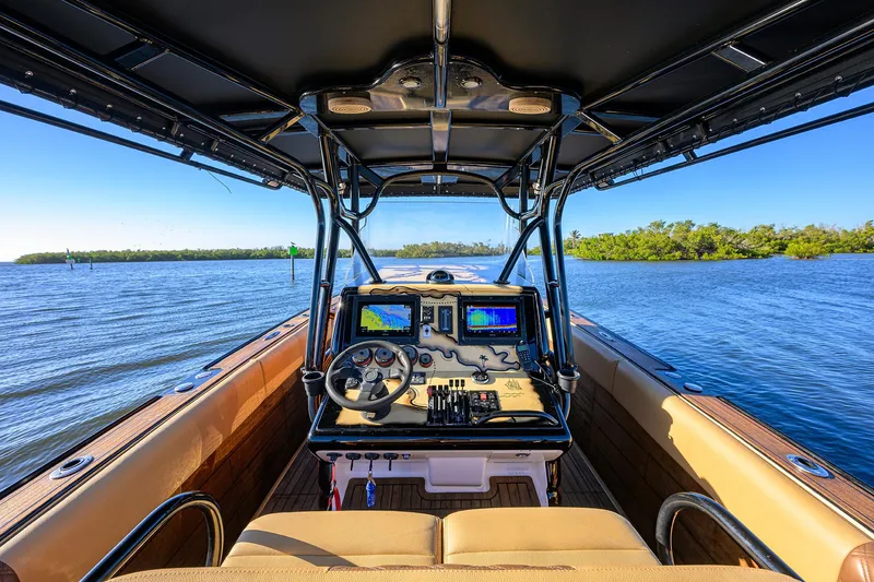 Slide: The Image of 2005 Midnight Express 39S Open boat interior with navigation controls on open water. - 29