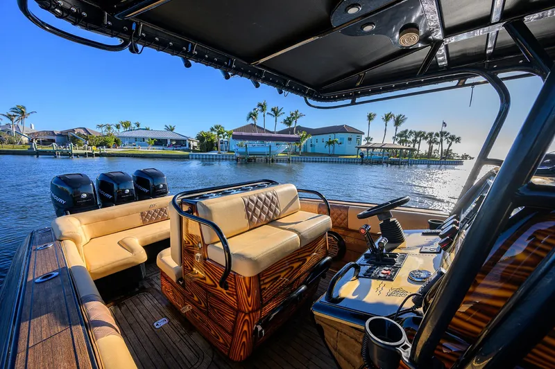 Slide: The Image of 2005 Midnight Express 39S Open boat interior with luxurious seating and scenic waterfront view. - 32