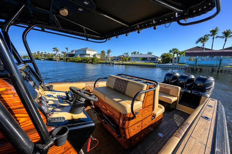 Slide: The Image of 2005 Midnight Express 39S Open boat interior with luxurious seating and scenic waterfront view. - 33