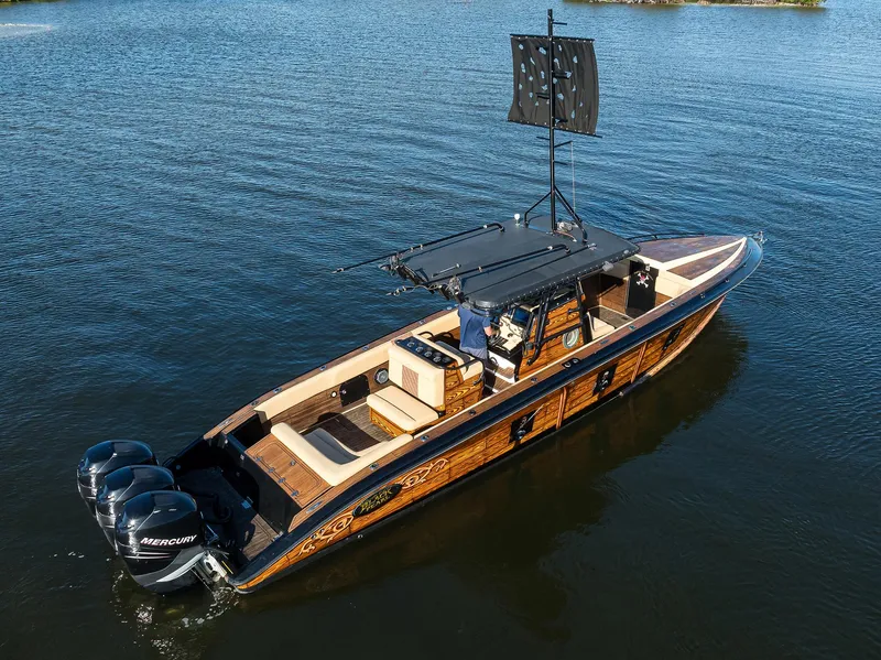 Slide: The Image of 2005 Midnight Express 39S Open boat on water, featuring sleek design and powerful engines. - 41