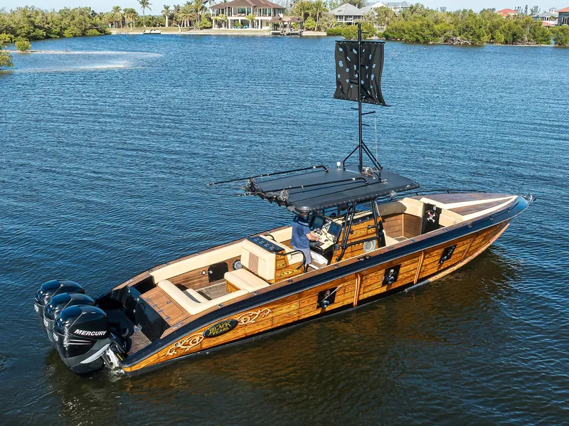 Slide: The Image of 2005 Midnight Express 39S Open boat on water, featuring sleek design and powerful engines. - 42