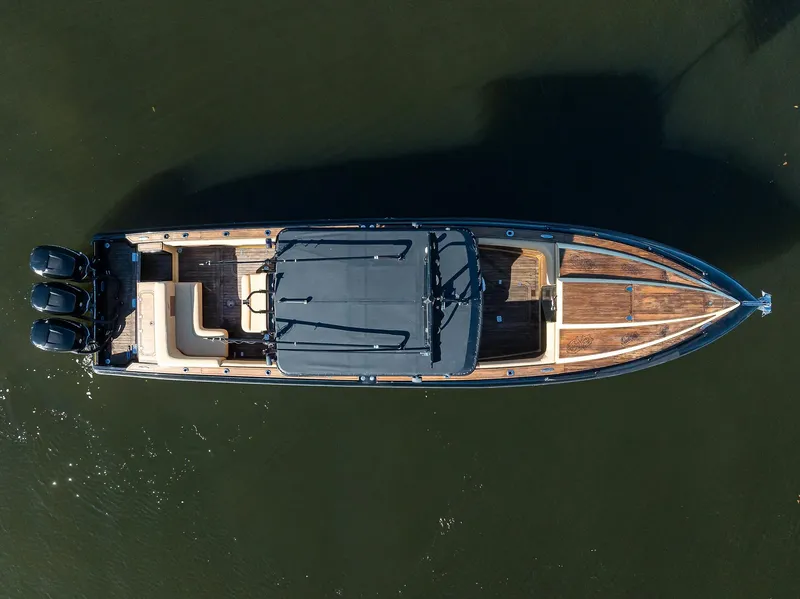 Slide: The Image of 2005 Midnight Express 39S Open boat, aerial view, on calm water. - 44