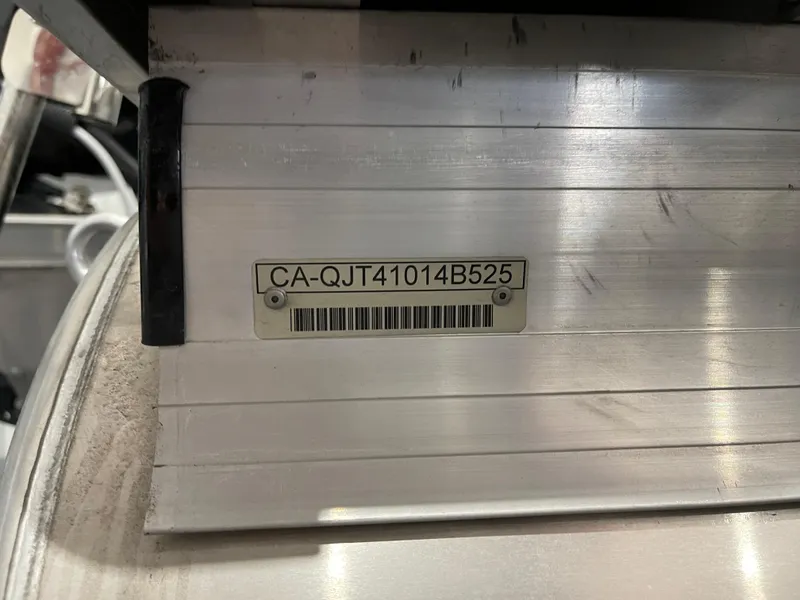 Slide: The Image of 2025 Princecraft Vectra 25 RL boat identification number on metal surface. - 16