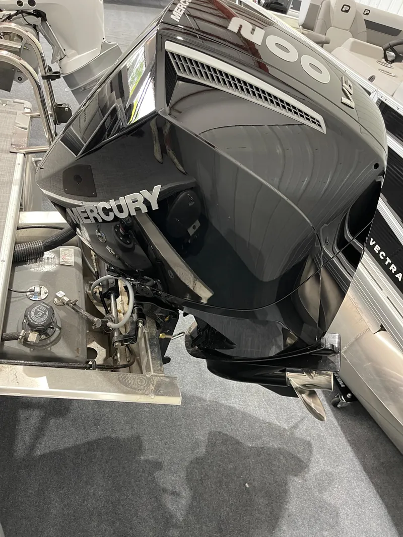 Slide: The Image of 2025 Princecraft Vectra 25 RL with Mercury outboard motor, showcasing sleek design and power. - 2