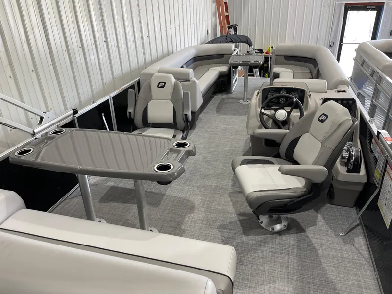 Slide: The Image of 2025 Princecraft Vectra 25 RL pontoon boat interior with seating and steering console. - 6