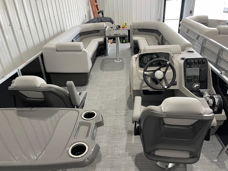 Slide: The Image of 2025 Princecraft Vectra 25 RL pontoon boat interior with modern seating and steering console. - 8