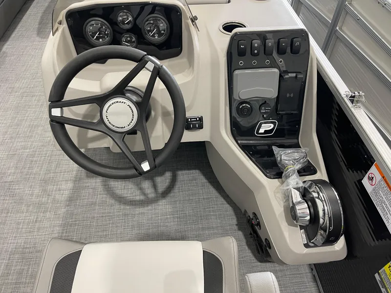 Slide: The Image of 2025 Princecraft Vectra 25 RL boat dashboard with steering wheel and control panel. - 9