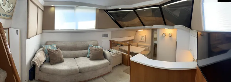 Slide: The Image of Interior of 1993 Silverton 34 Aft Cabin Motor Yacht with cozy seating and modern design. - 17