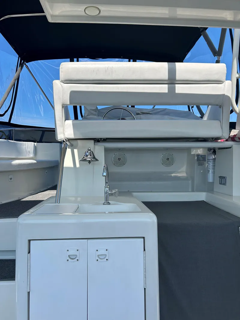 Slide: The Image of 1993 Silverton 34 Aft Cabin Motor Yacht interior with seating and sink. - 24