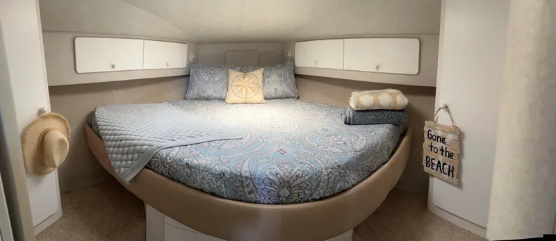 Slide: The Image of Cozy bedroom in 1993 Silverton 34 Aft Cabin Motor Yacht with nautical decor. - 3