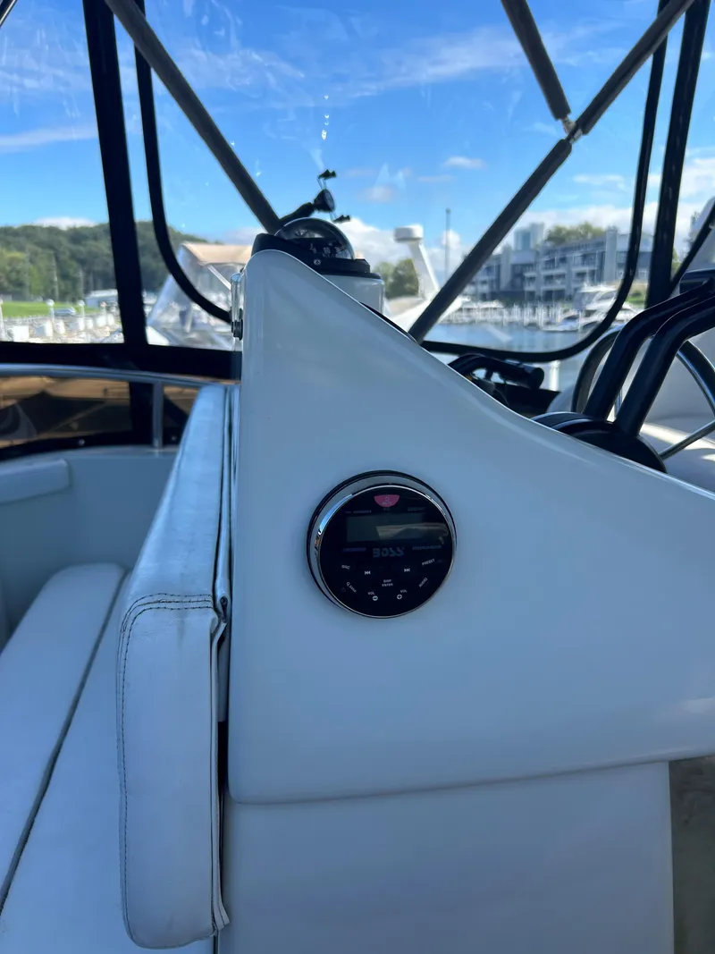Slide: The Image of 1993 Silverton 34 Aft Cabin Motor Yacht interior with scenic marina view. - 30