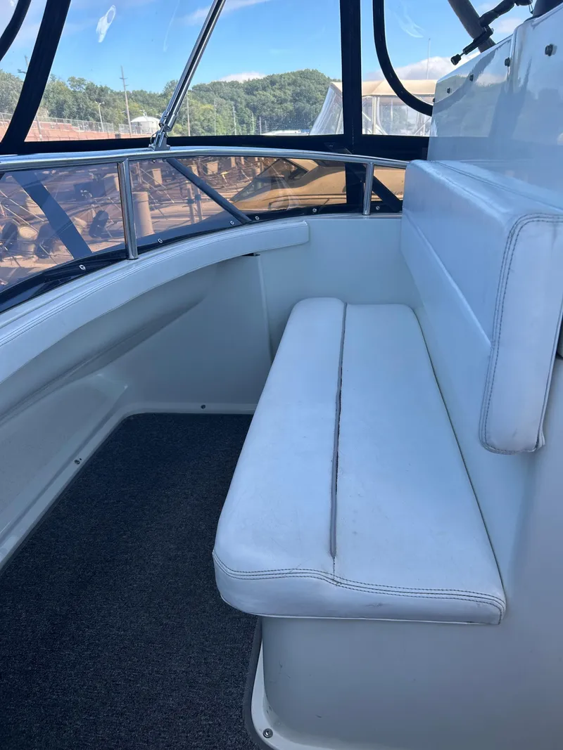 Slide: The Image of 1993 Silverton 34 Aft Cabin Motor Yacht interior seating area. - 31
