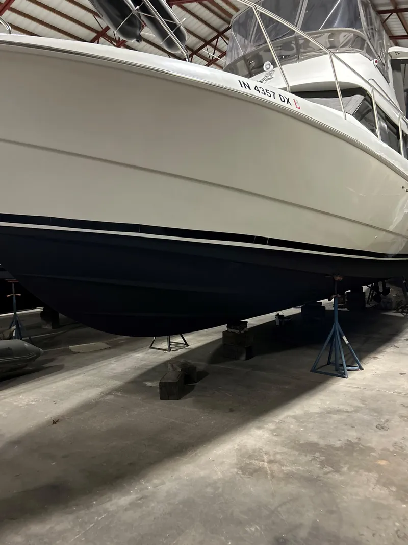 Slide: The Image of 1993 Silverton 34 Aft Cabin Motor Yacht in storage, side view. - 32